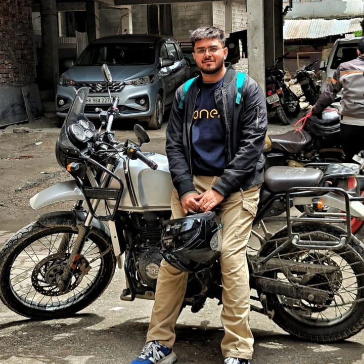 With a Royal Enfield Himalayan on a mountain ride stop